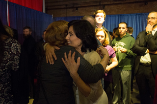 Democratic candidate Juanita Perez Williams embraces someone at her watch party on Tuesday night.