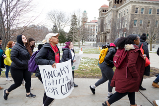 Dozens of students gathered at Schine Student Center and then started marching toward the Carrier Dome at about 10:30 a.m. 