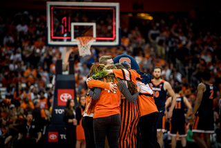 The SU students who are “Otto,” the team mascot, were revealed Monday in the first half. 