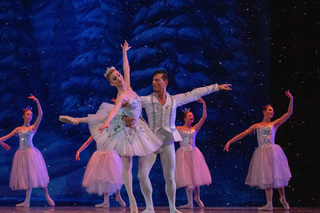 The Snow King and Queen dance to Tchaikovsky's Waltz of the Snowflakes. Snow fell onto the stage as the dancers twisted and turned across the stage. 